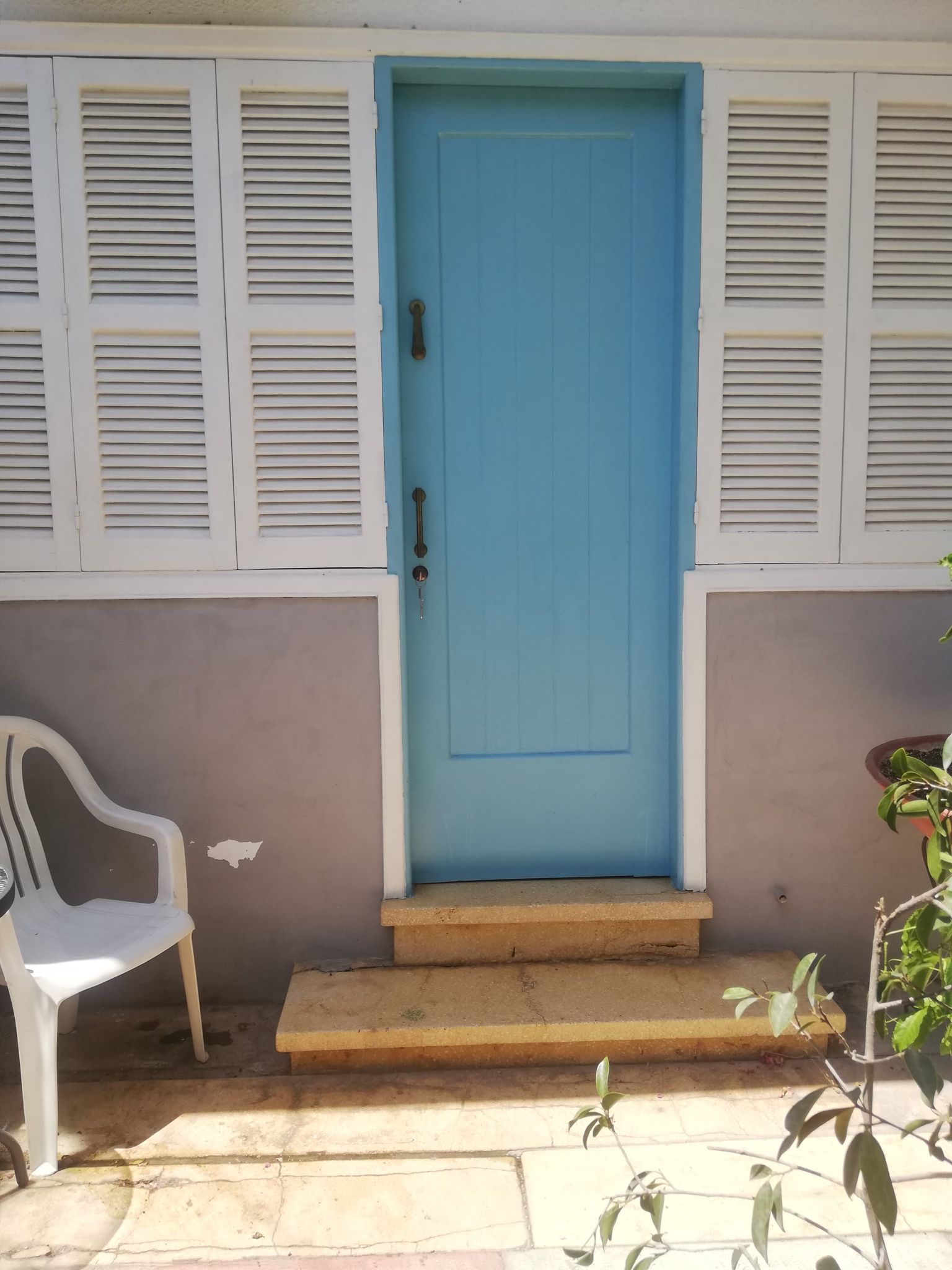 The front door with a chair